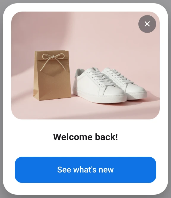 The AI-generated "Welcome back!" in-app modal with a product image, close button, and CTA, added through the editor's Image field