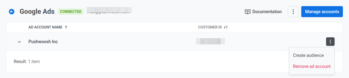 Página do Google Ads no Pushwoosh com a tabela de contas de anúncios conectadas mostrando nome, ID e ações do menu de linha