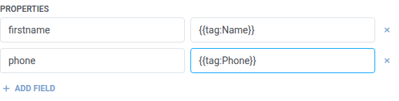 Tabla de nombre y valor de Propiedades de HubSpot con firstname y phone mapeados a macros de tag