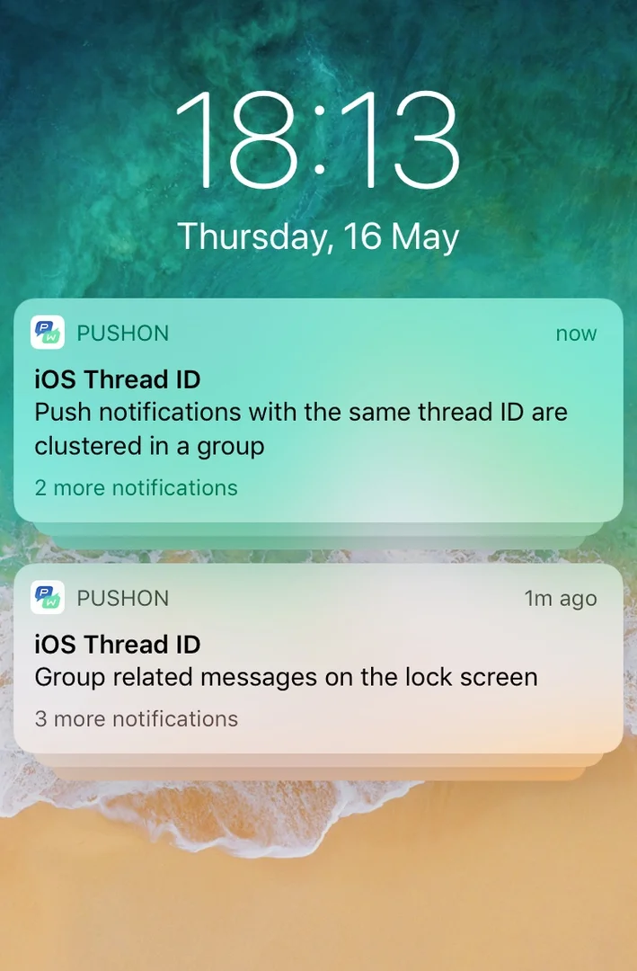 iPhone 锁定屏幕,显示具有两个不同线程 ID 的分组推送通知分别显示